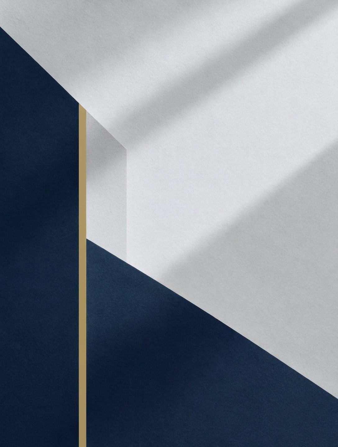 Abstract composition of layered geometric planes in navy, cool grey, and muted gold